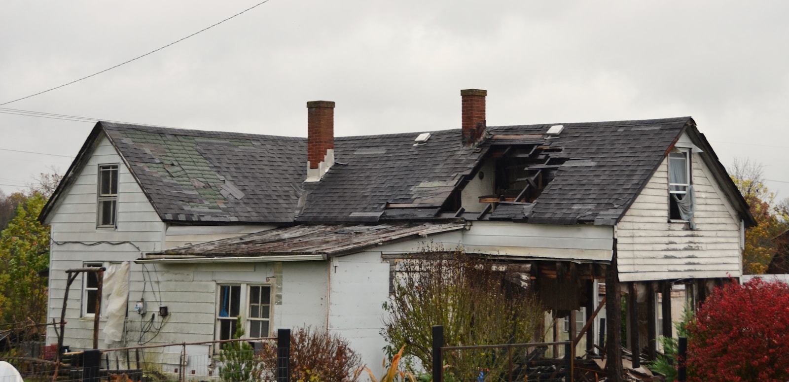 Storm damaged roof shingles