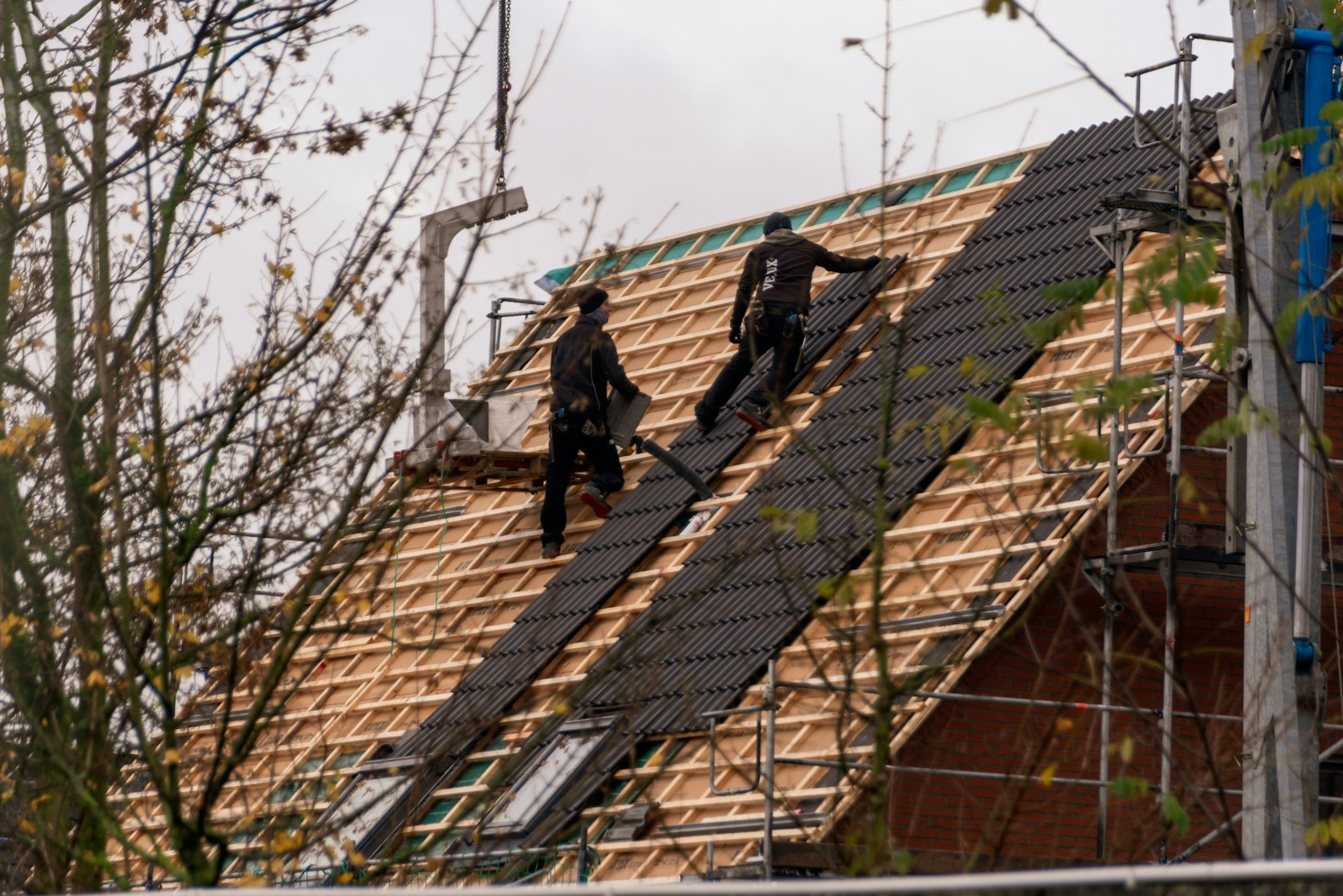 Crew installing roof